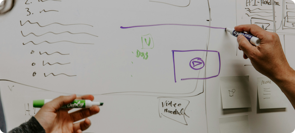 Vibrant abstract painting with swirling red, yellow, and pink hues on a canvas.